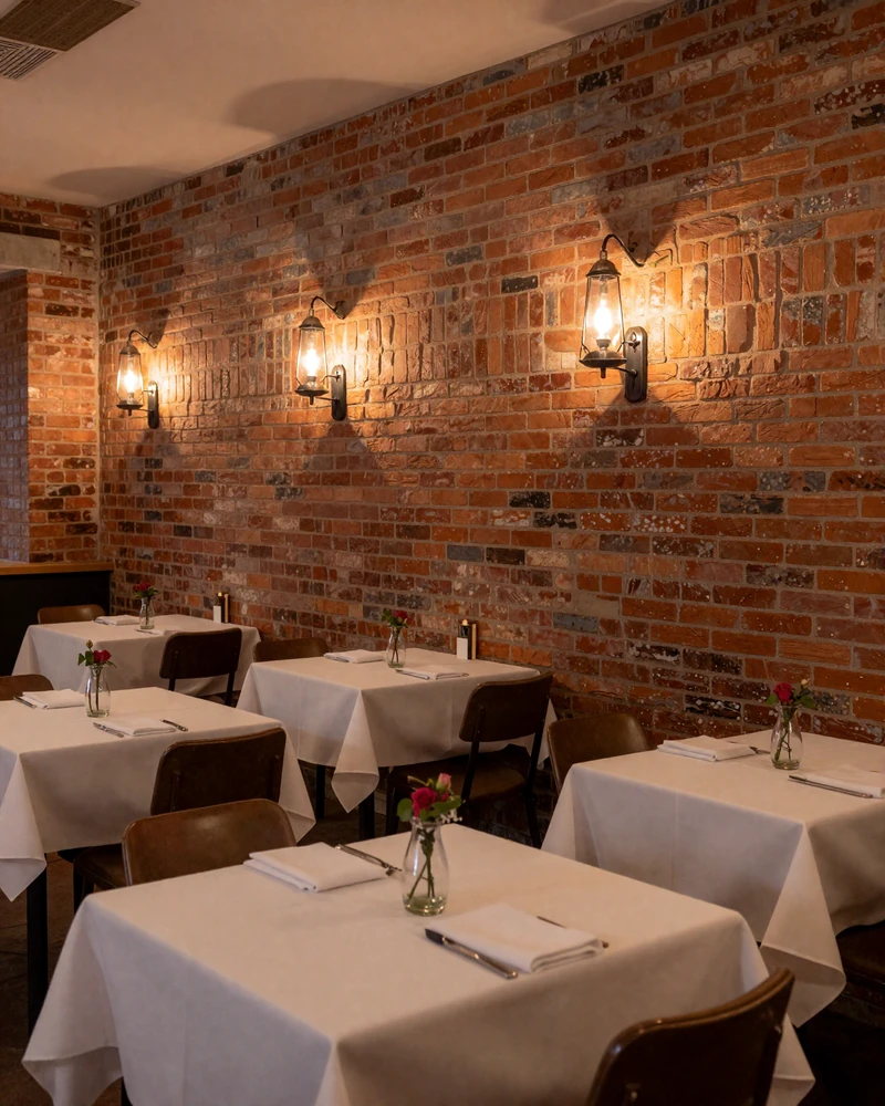 Historic German Village restaurant interior with brick walls and gas lamps